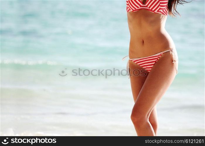 Woman on sea background. Beautiful woman in bikini on sea background