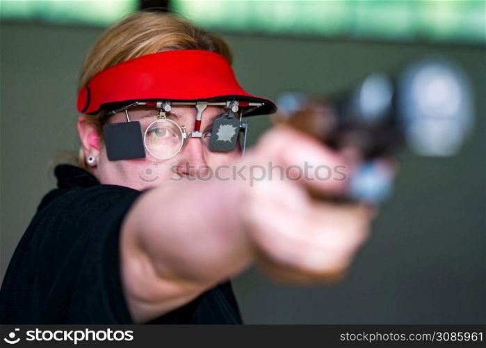 Woman on sport shooting training practicing for competition