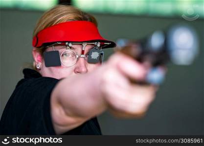 Woman on sport shooting training practicing for competition