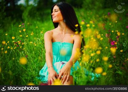 woman on summer flower field
