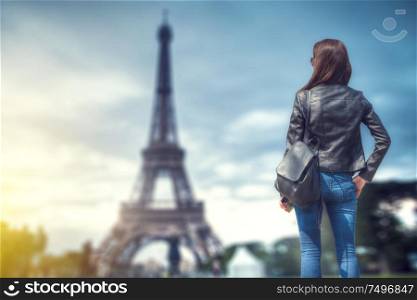 woman on the background of the eiffel tower