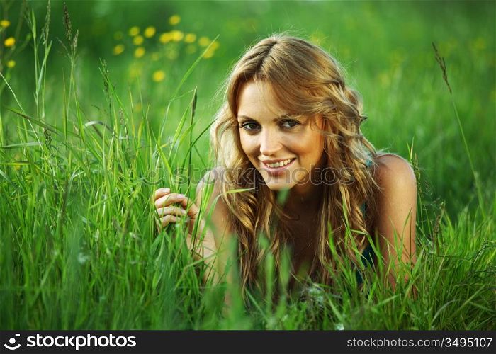 woman on the green grass happy and smile