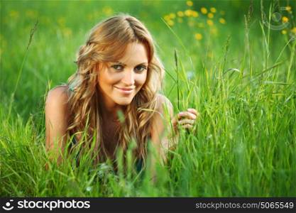 woman on the green grass happy and smile. woman on the grass