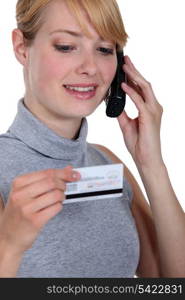 Woman on the phone with her credit card company