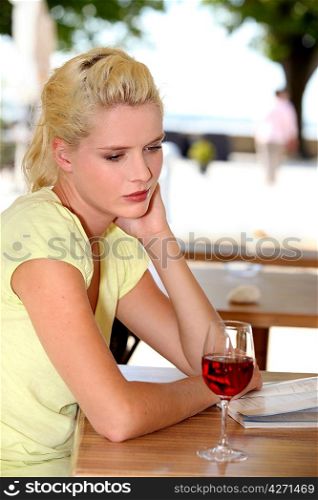 Woman on the terrace with a glass of wine
