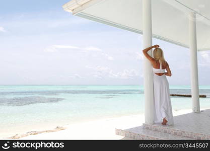 woman on the veranda of the tropical house