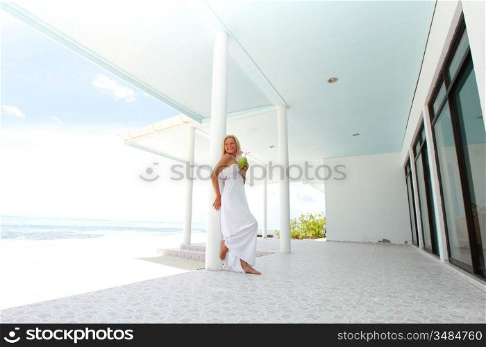 woman on the veranda of the tropical house