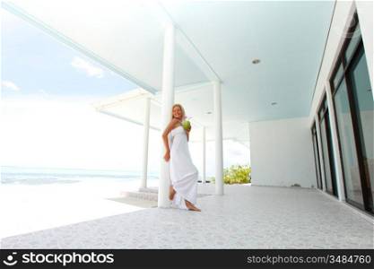 woman on the veranda of the tropical house