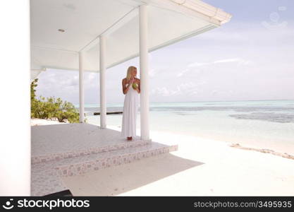 woman on the veranda of the tropical house