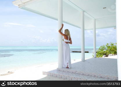 woman on the veranda of the tropical house