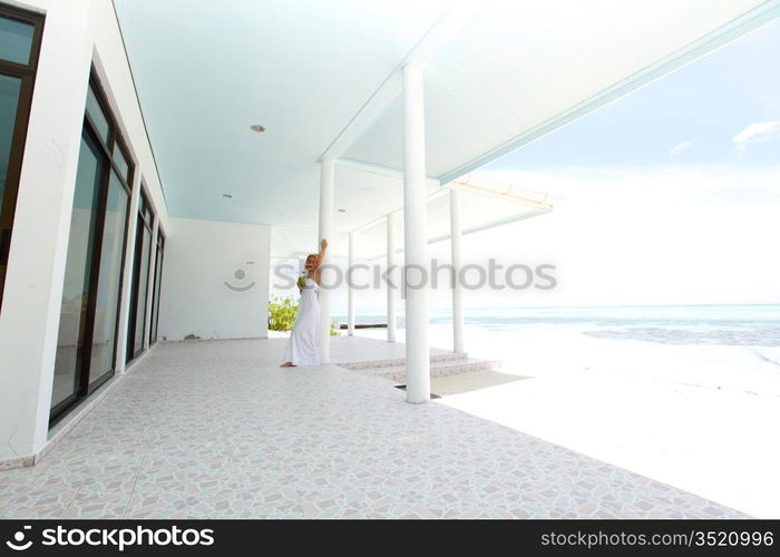 woman on the veranda of the tropical house