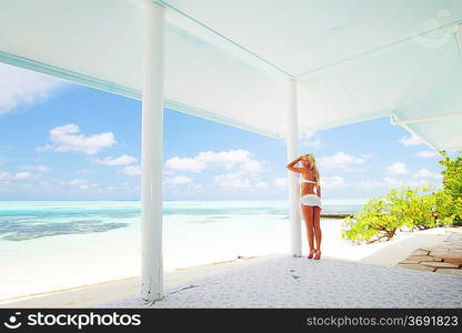 woman on the veranda of the tropical house