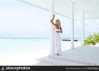 woman on the veranda of the tropical house. tropic woman on the veranda