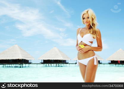 woman on tropical beach house back on the background