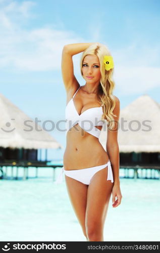 woman on tropical beach house back on the background