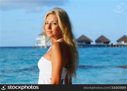 woman on tropical beach house back on the background