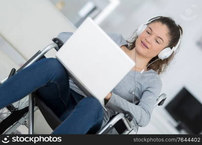 woman on wheelchair with laptop