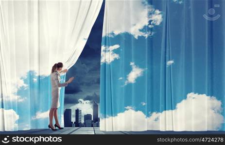 Woman open curtain. Businesswoman pulling curtain and cityscape behind it