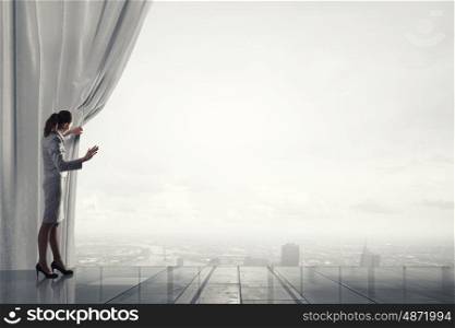 Woman open curtain. Businesswoman pulling curtain and cityscape behind it