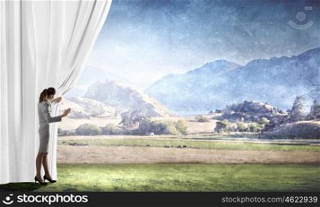 Woman open curtain. Young businesswoman opening stage curtain to another reality