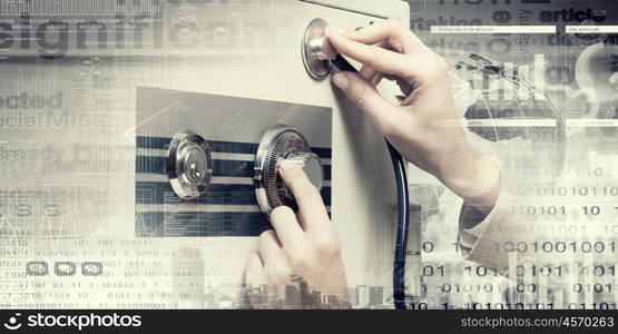 Woman open safe. Hands of woman dialing numbers on safe padlock