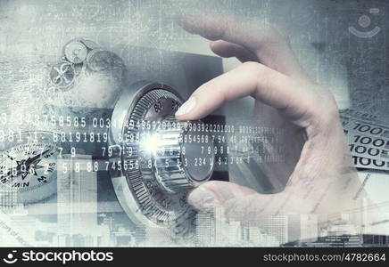 Woman open safe. Hands of woman dialing numbers on safe padlock