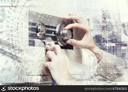 Woman open safe. Hands of woman dialing numbers on safe padlock