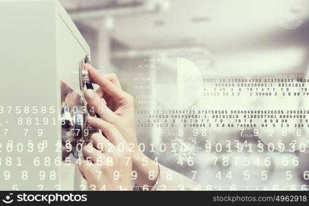 Woman open safe. Hands of woman dialing numbers on safe padlock