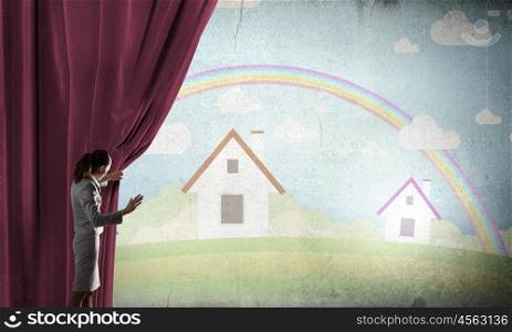 Woman opening curatin. Young businesswoman opening stage curtain to another reality