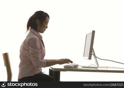 Woman operating a PC