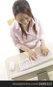 Woman operating a PC