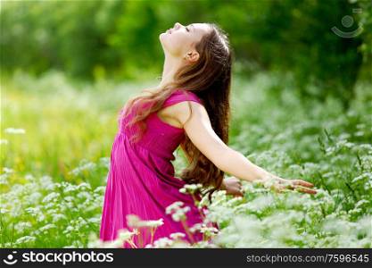 Woman outdoor feel natural freedom, summer flower meadow. Woman feel natural freedom