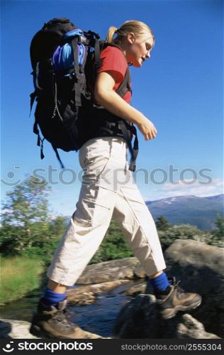 Woman outdoors hiking in scenic location (selective focus)