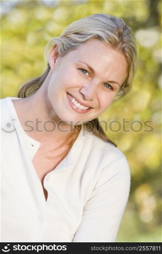 Woman outdoors smiling