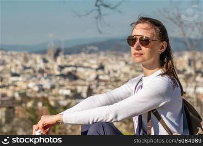 Woman overlooking Barcelona cityscape from Montjuic, Catalonia, Spain