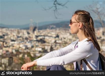 Woman overlooking Barcelona cityscape from Montjuic, Catalonia, Spain