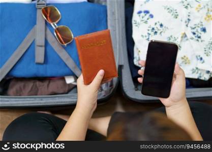 Woman packs baggage and passport in the suitcase prepared to travel new journey packing a luggage travel plans vacation