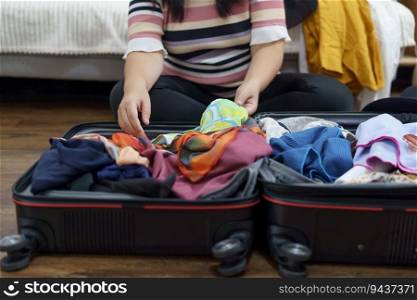 Woman packs baggage in suitcase for new journey packing a luggage travel plans vacation.