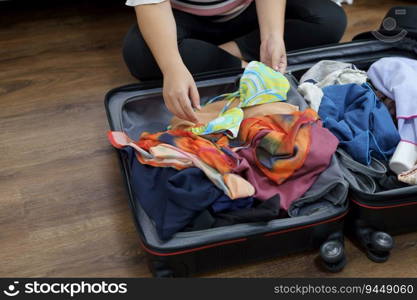 Woman packs baggage in suitcase for new journey packing a luggage travel plans vacation.