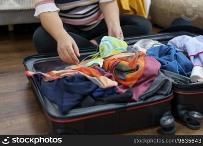 Woman packs baggage in suitcase for new journey packing a luggage travel plans vacation.