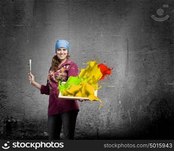 Woman painter. Young woman painter with palette and brush