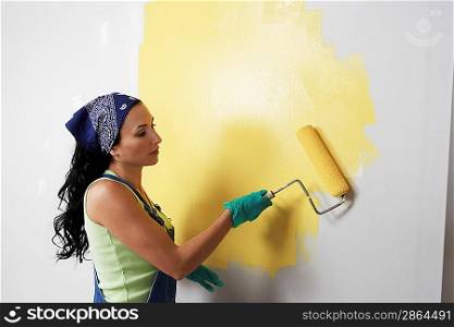 Woman Painting Room with Roller