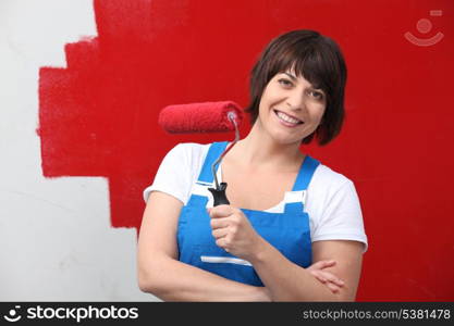 Woman painting wall