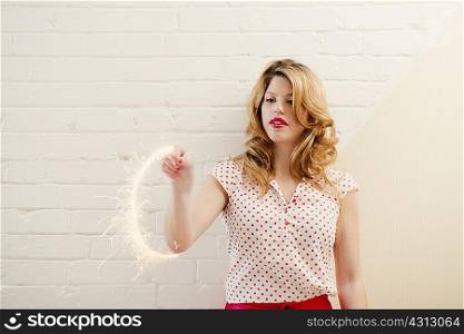 Woman painting with sparklers