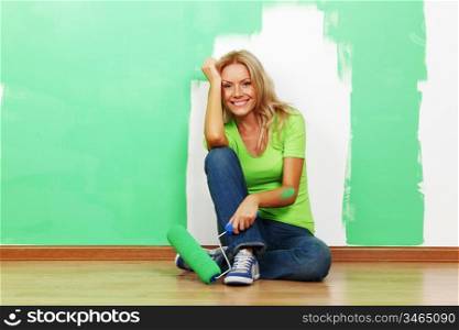 woman paints the wall brush isolated