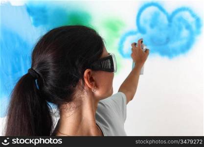 woman paints the wall of balon