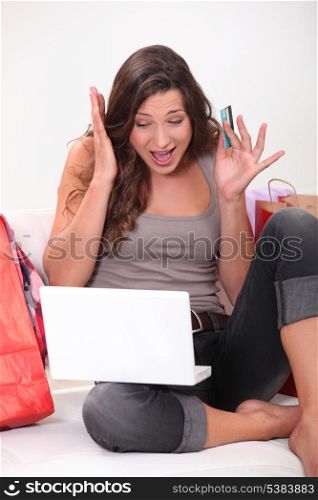 Woman panicking whilst shopping online