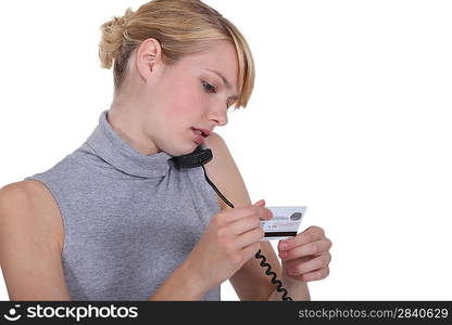 Woman paying bills over the phone