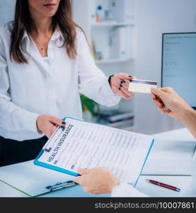 Woman Paying Health Insurance with Credit Card . Paying Health Insurance with Credit Card 