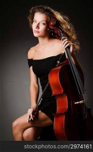 Woman performer with cello in studio